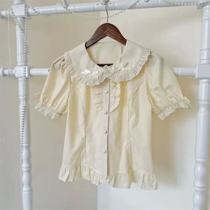Chemisier Lolita Doux pour Femme Blanc à Manches Courtes avec Volants et Nœud Style Japonais Kawaii Top Décontracté Fille Rétro Mignon Subculture Été 2026