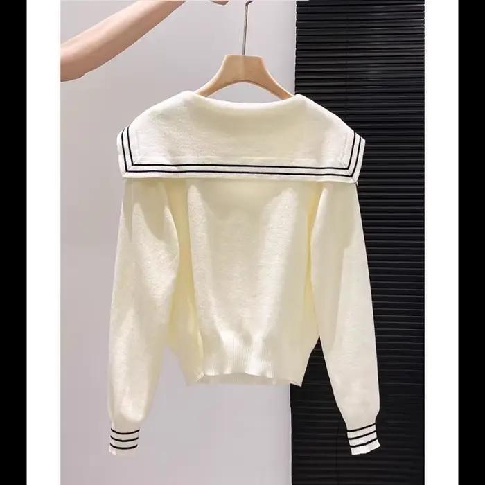 Pull tricoté épissé à col bleu marine pour femme