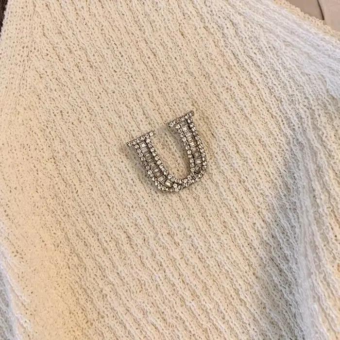 Débardeur court blanc à strass avec logo U et ourlet à franges pour femme