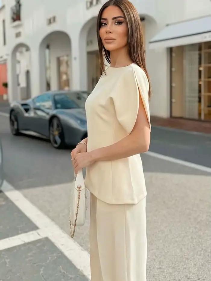 Blouse élégante unie à manches bouffantes et ourlet asymétrique col rond pour femme HH – T-shirts tendance printemps